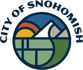 The City of Snohomish logo, depicting the sun rising over the mountains and river valley